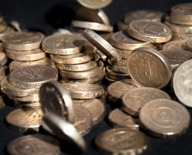 "British coins. Could be The economy, wages, home finance, savings, etc."